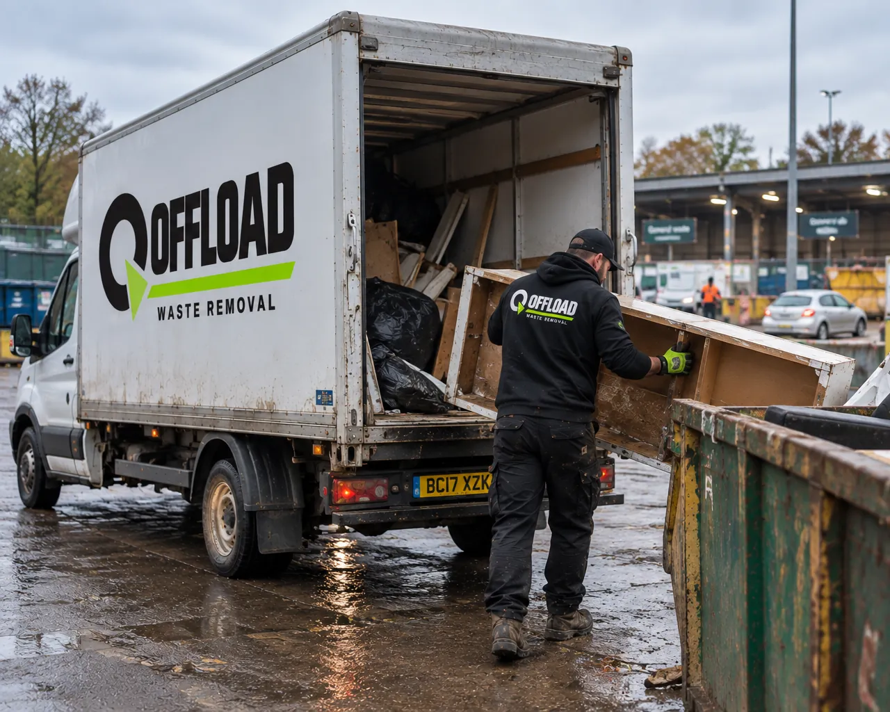 Offload waste removal Leeds crew member unloading furniture and timber from a van into a skip